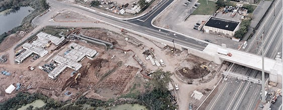 Aerial view of Potter's field excavation site next to highway