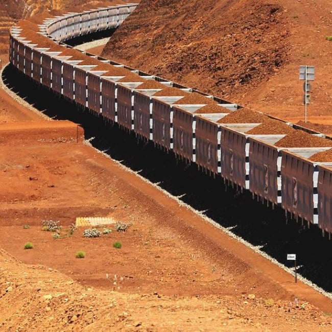 Train carrying mining material transport infrastructure